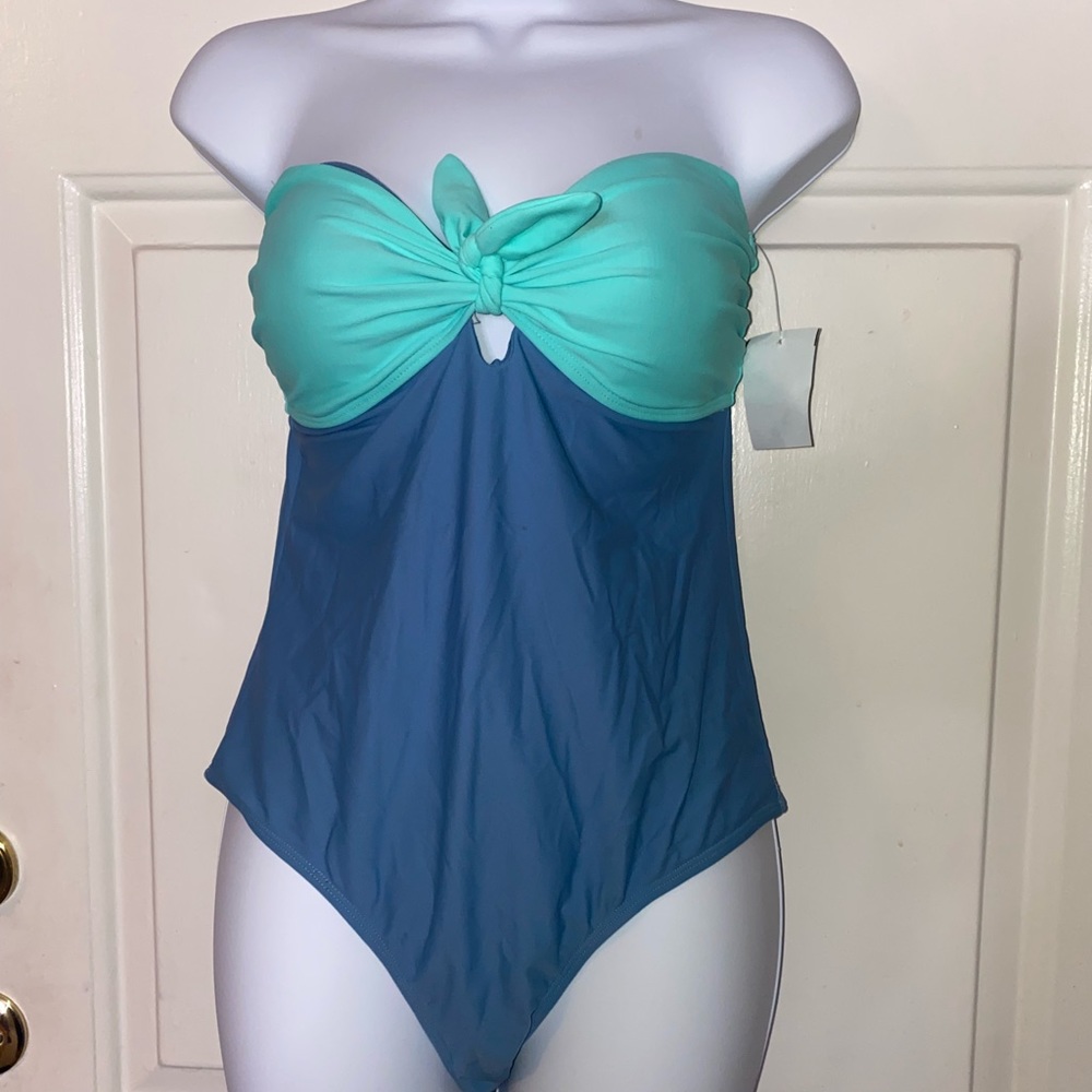 A bandeau style and colorblock design in this one piece swimsuit by TRUE CRAFT